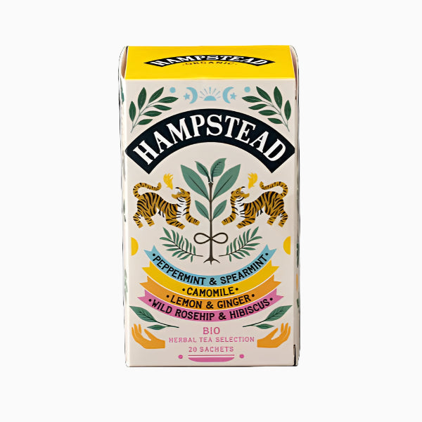 A box of Hampstead Organic Herbal Tea with illustrations of peppermint, spearmint, camomile, lemon, ginger, rosehip, and hibiscus on the packaging.