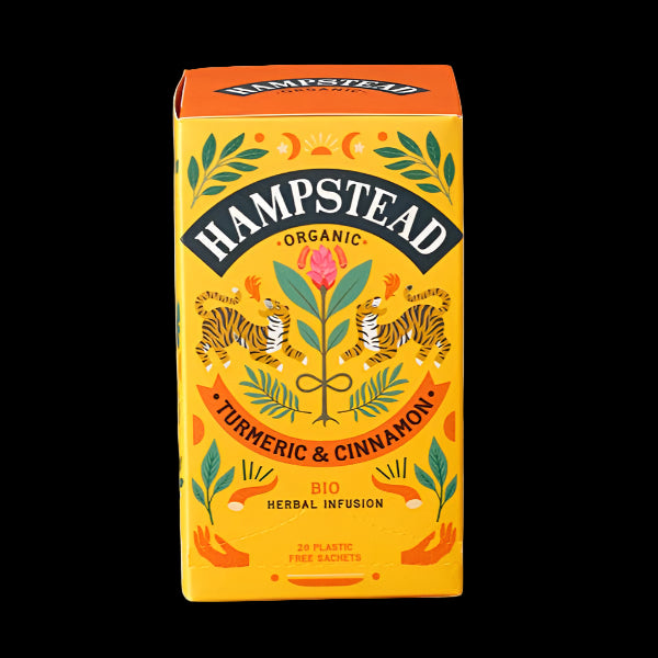 A package of Hampstead Organic Turmeric & Cinnamon Herbal Infusion tea. The packaging is colorful with illustrations of turmeric and cinnamon plants and the box is predominantly yellow.