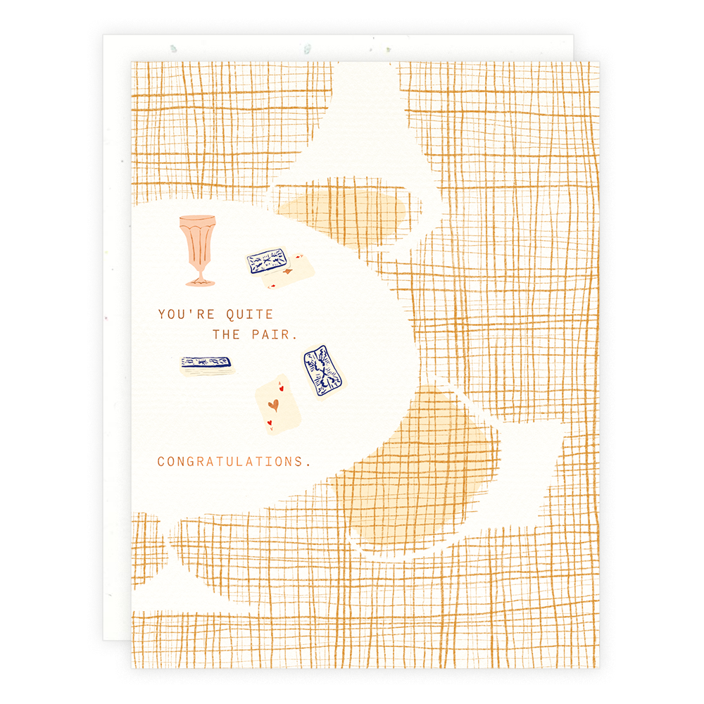 Greeting card with a geometric pattern and text that reads 'You're quite the pair. Congratulations.'