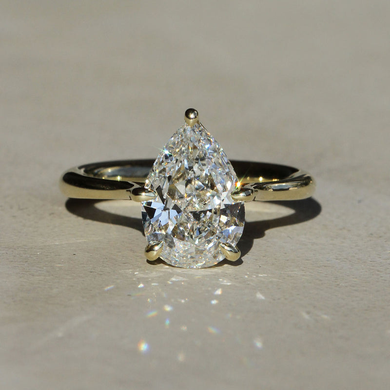 Sophie Hughes Iris Prong Solitaire in 14K Yellow Gold featuring a pear cut diamond