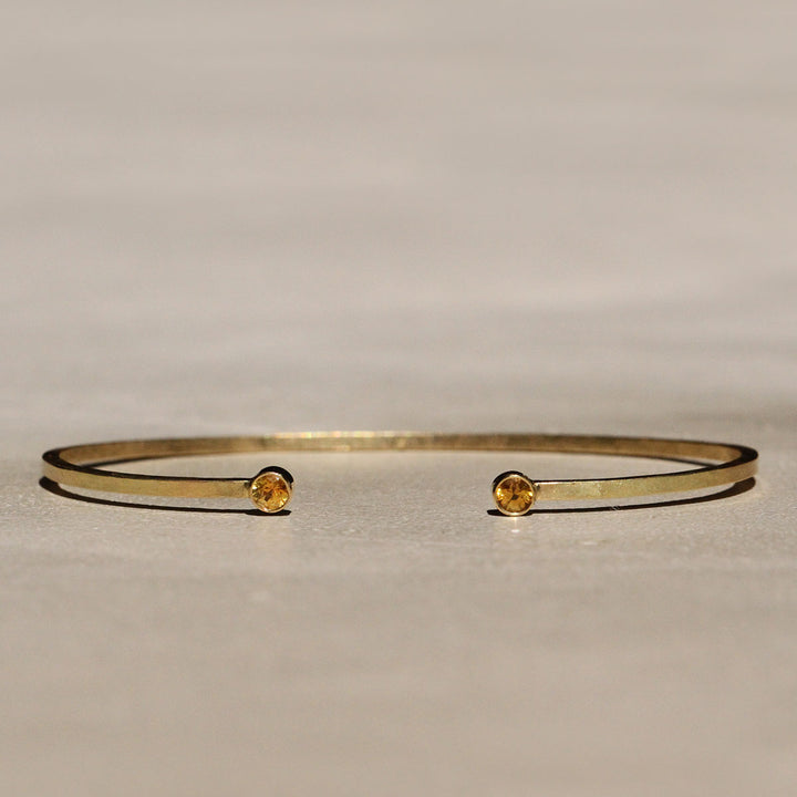 Sophie Hughes Yellow Montana Sapphire Cuff Bracelet in 18k Yellow Gold featuring two 3mm Dark Yellow Montana Sapphire round gemstones.