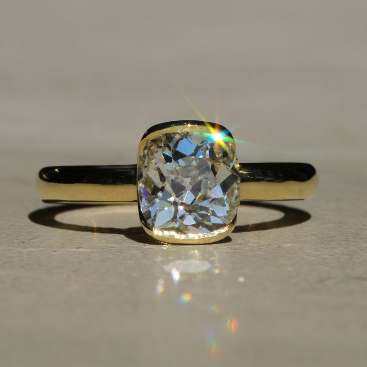 Sophie Hughes Poppy Bezel Solitaire in 18K Yellow Gold featuring a 1.5-ct Antique Old Mine cut diamond