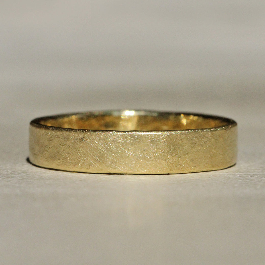 Sophie Hughes Narrow Flat Band in 18K Yellow Gold featuring a hammered rust texture