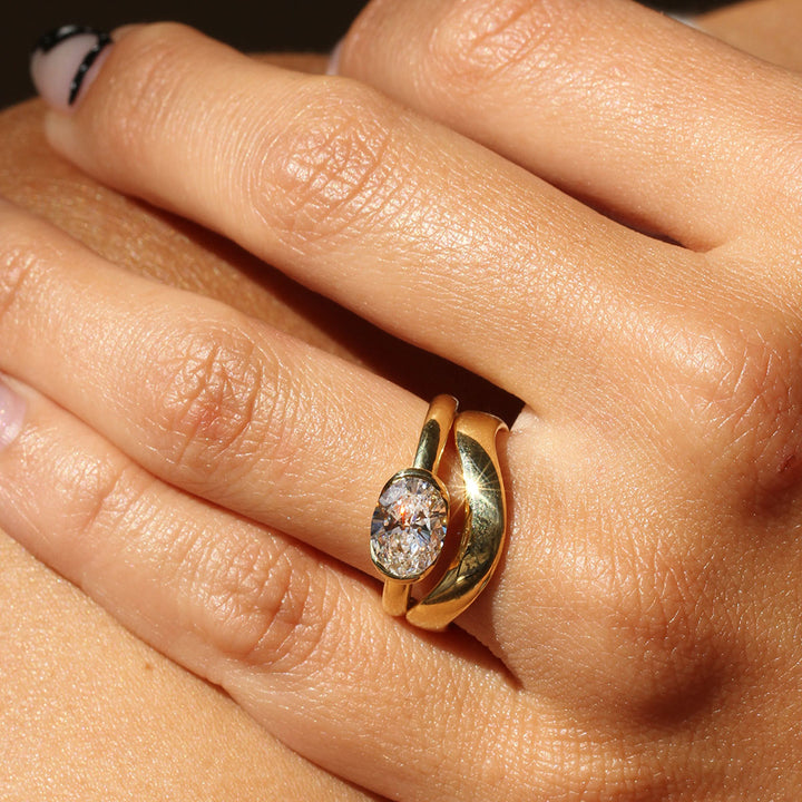 Poppy Bezel - East-West Oval Solitaire