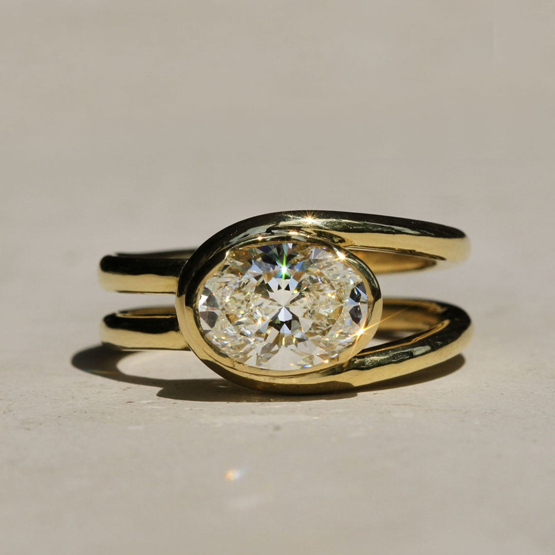 Sophie Hughes Poppy Bezel Loop Ring in 18k yellow gold featuring a 1.5-ct oval diamond set east-west