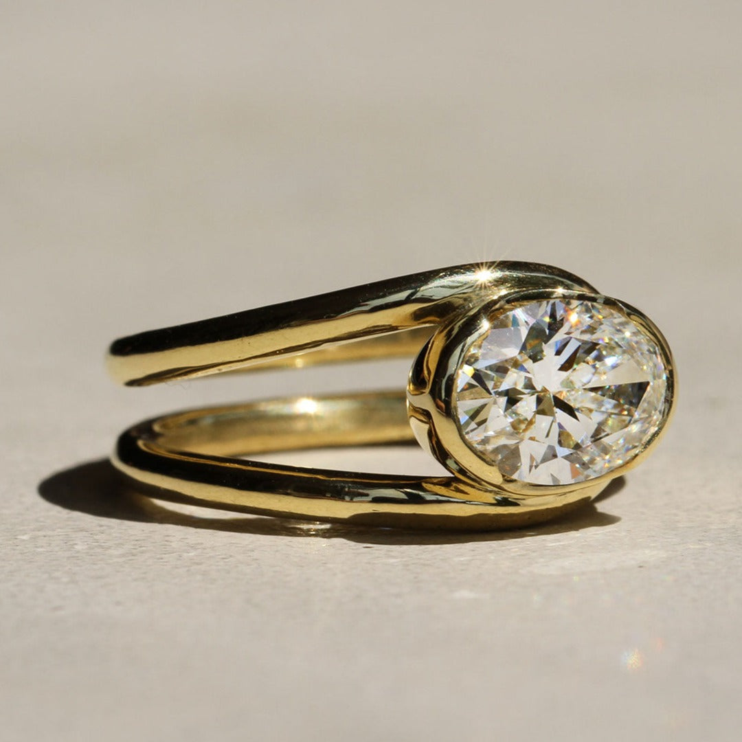 Sophie Hughes Poppy Bezel Loop Ring in 18k yellow gold featuring a 1.5-ct oval diamond set east-west, at a slight angle