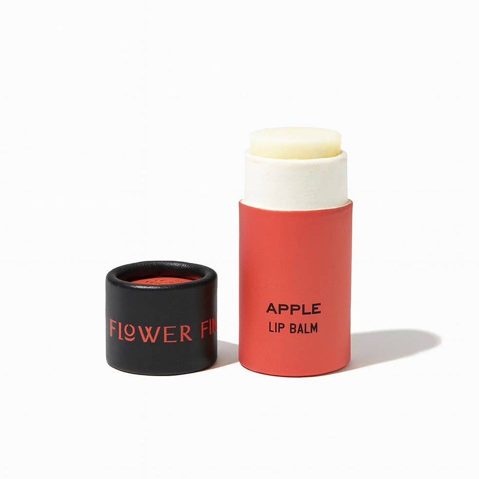 Good Flower Farm Apple Lip balm container on a white background
