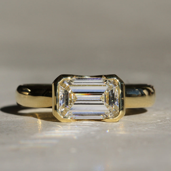 Poppy Bezel - East-West Emerald Cut Solitaire (LG)