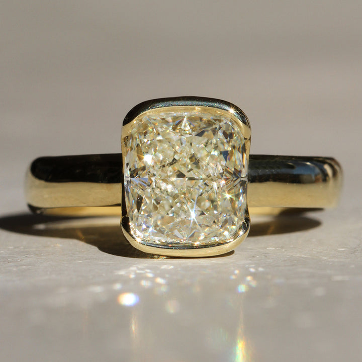 Poppy Bezel - North-South Cushion Solitaire