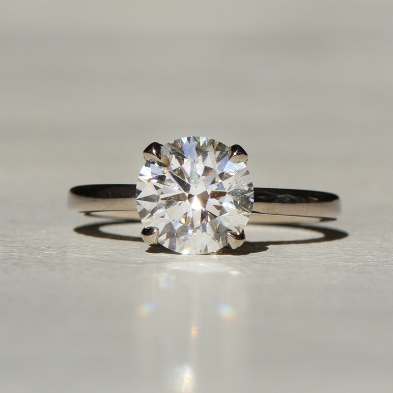 Sophie Hughes Lily Prong Solitaire in 18K Grey Gold featuring a Round Brilliant diamond
