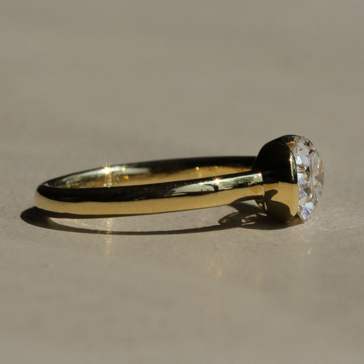 Poppy Bezel - East-West Oval Solitaire