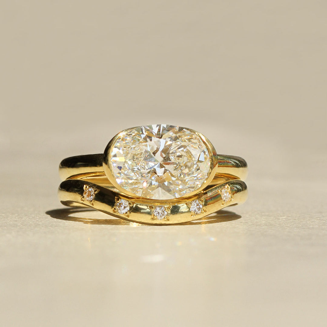 Poppy Bezel - East-West Oval Solitaire