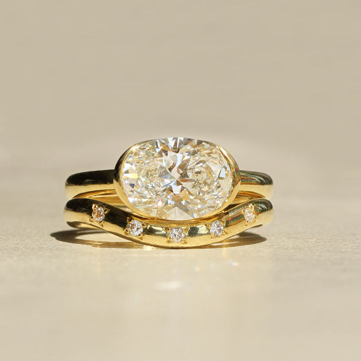 Poppy Bezel - East-West Oval Solitaire
