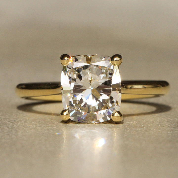 Sophie Hughes Iris Prong Solitaire in 18K Yellow Gold featuring a 2.5-carat Cushion Cut Diamond