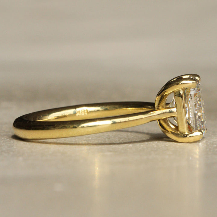 Sophie Hughes Iris Prong Solitaire in 18K Yellow Gold featuring a 2.5-carat Cushion Cut Diamond from the side