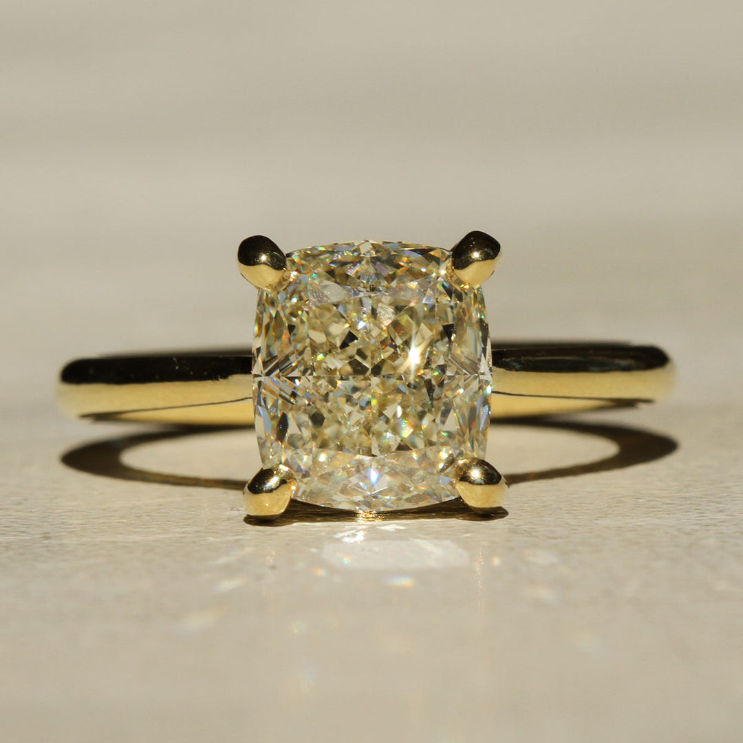 Sophie Hughes Iris Prong Solitaire in 18K Yellow Gold featuring a 3-carat Cushion Cut Diamond