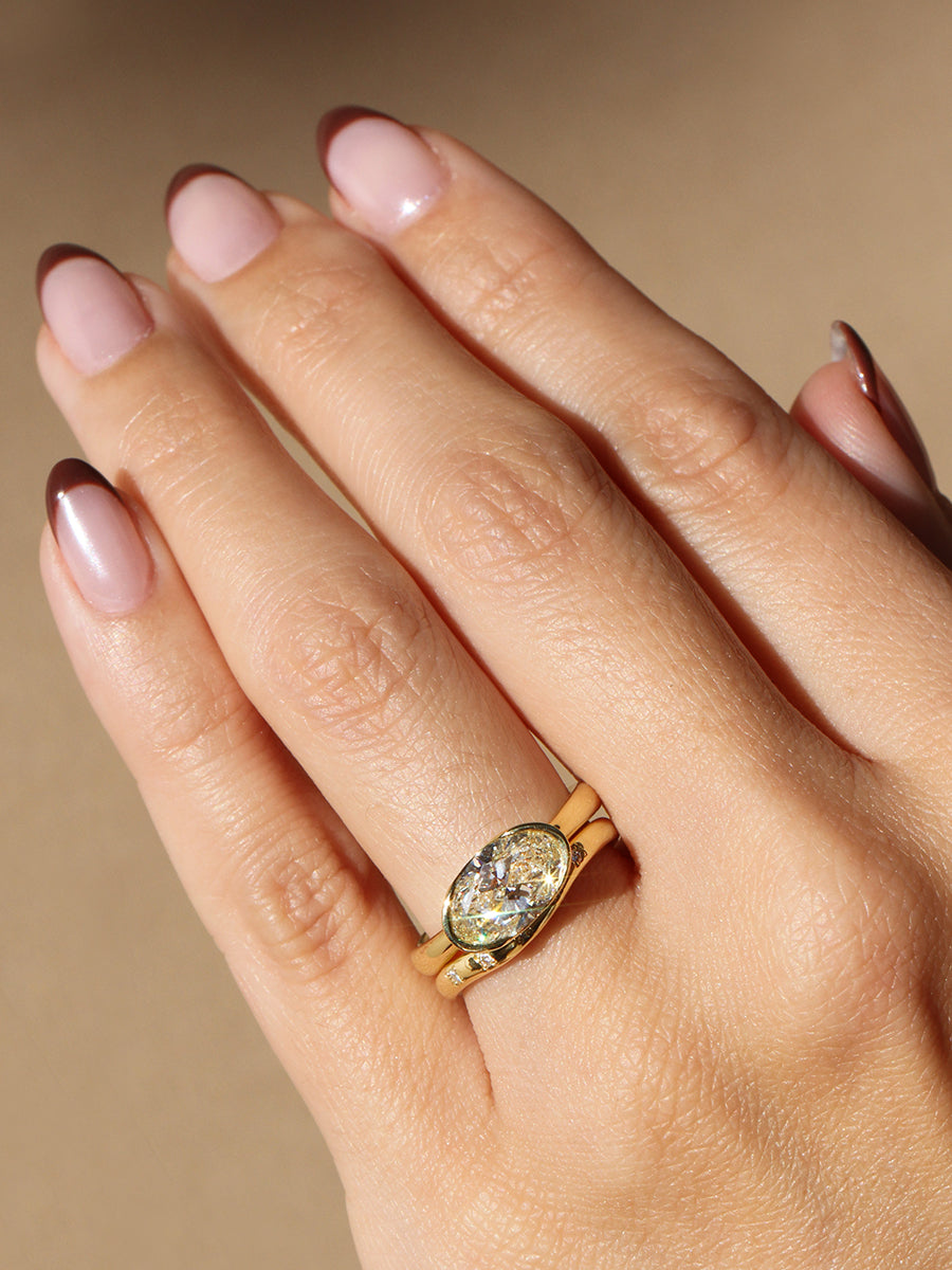 Poppy Bezel - East-West Oval Lofted Solitaire