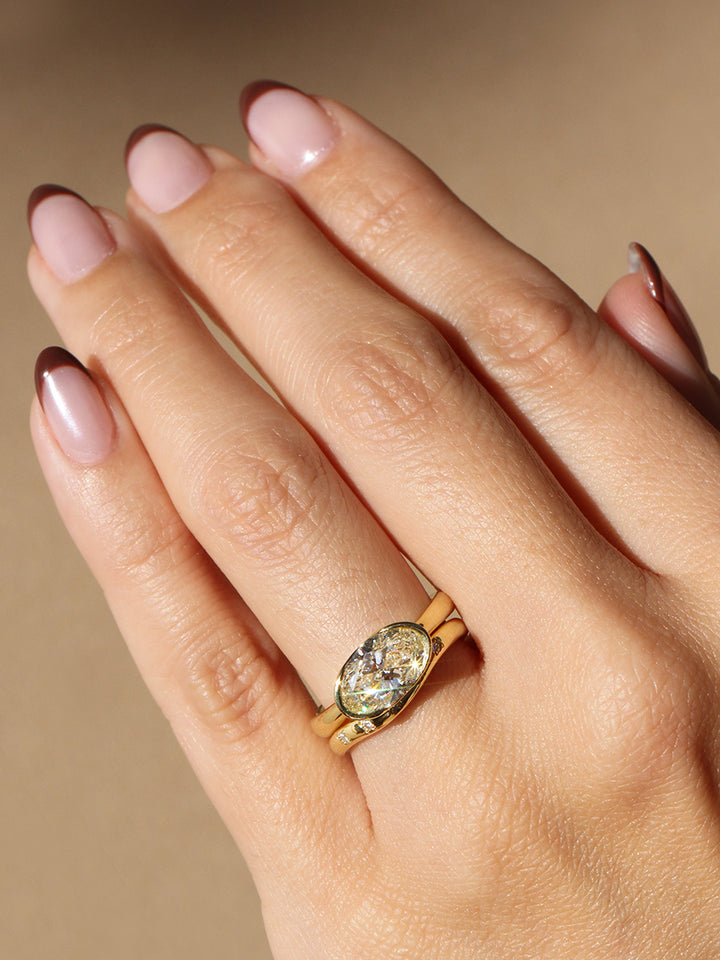 Poppy Bezel - East-West Oval Lofted Solitaire