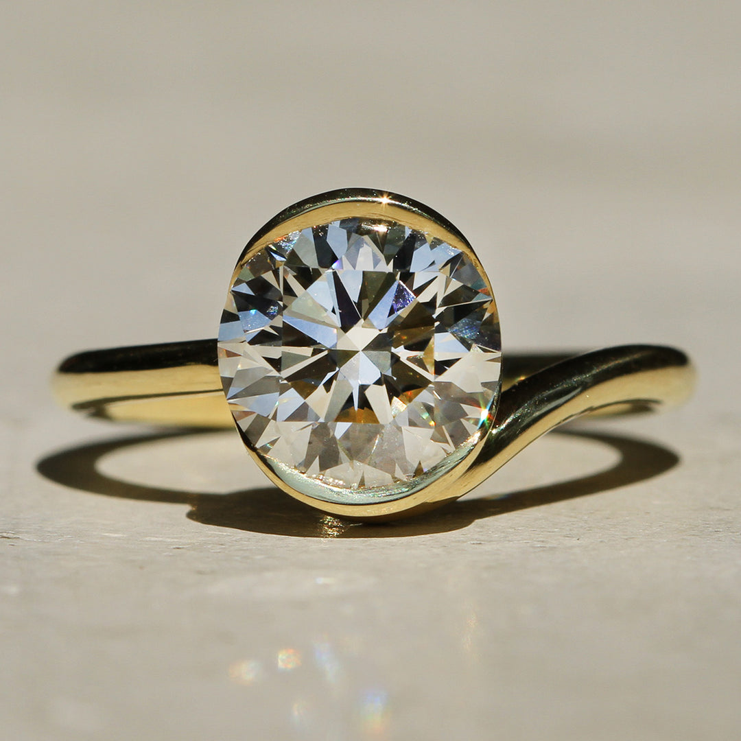 Sophie Hughes Poppy Bezel Wave Solitaire featuring 18K Yellow Gold and a 2-carat Round Brilliant Diamond